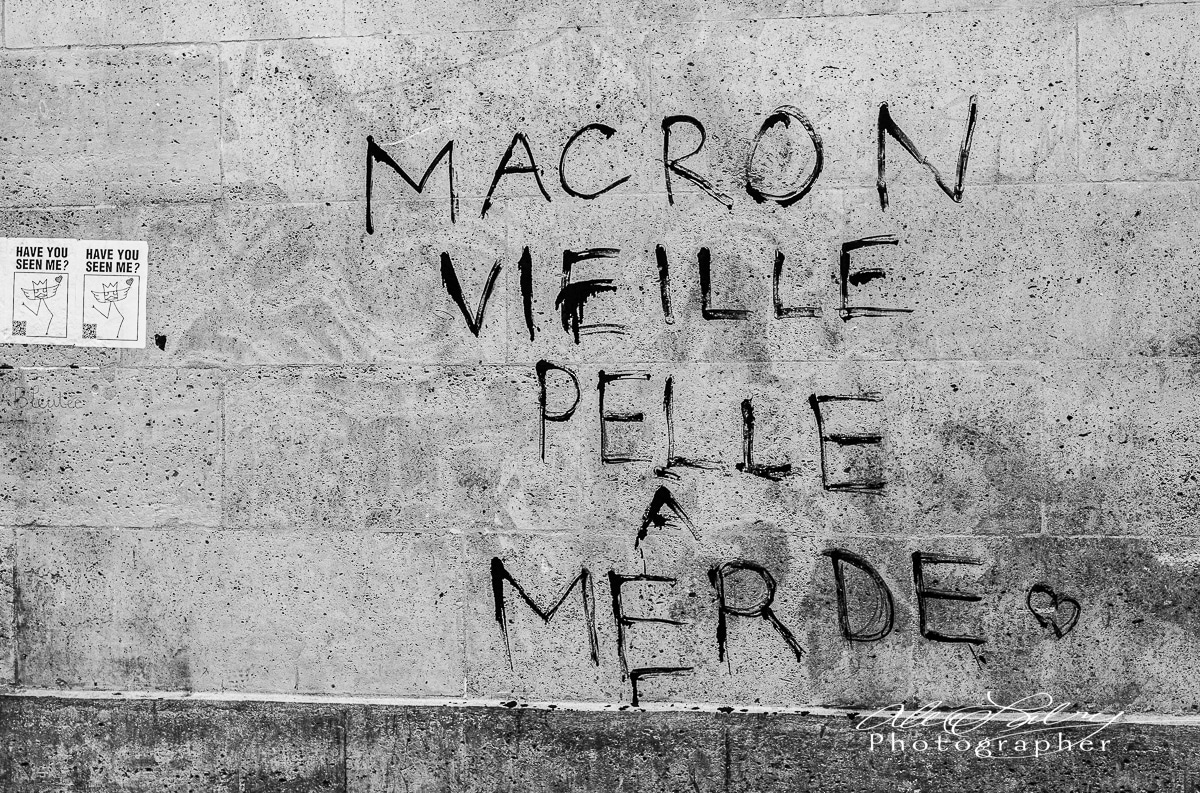 "Old Marcron shovlels shit,"  Paris, France, 2023